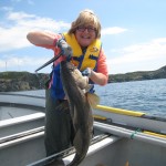 Photo Of A Woman Holding A Big Fish